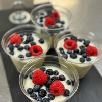 a cake with fruit on top of a table