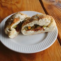 a plate of food sitting on top of a wooden table