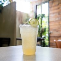 a cup of coffee and a glass of beer on a table